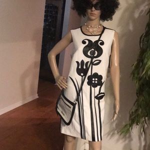 White dress with black leather deign